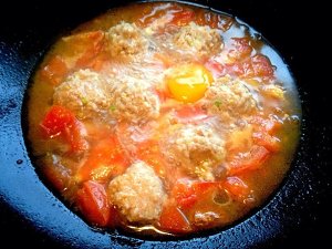 Close child the practice measure of rice served with meat and vegetables on top of tomato a round mass of food 8