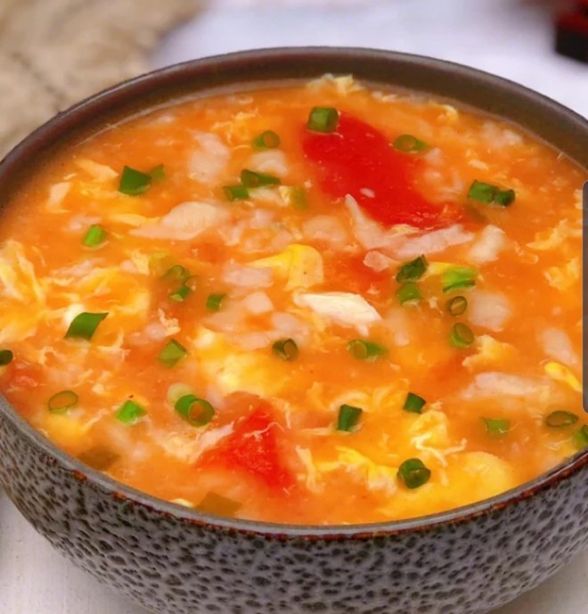 
The practice of soup of tomato egg a knot in one's heart, how to do delicious