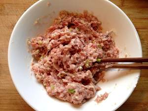 Close child the practice measure of rice served with meat and vegetables on top of tomato a round mass of food 2